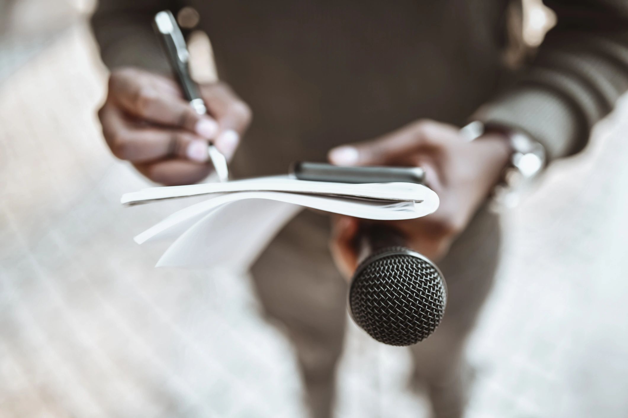 Journalist preparing questions for a press conference
